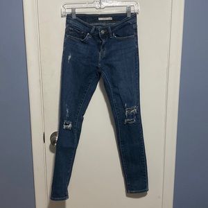 Distressed skinny jean.